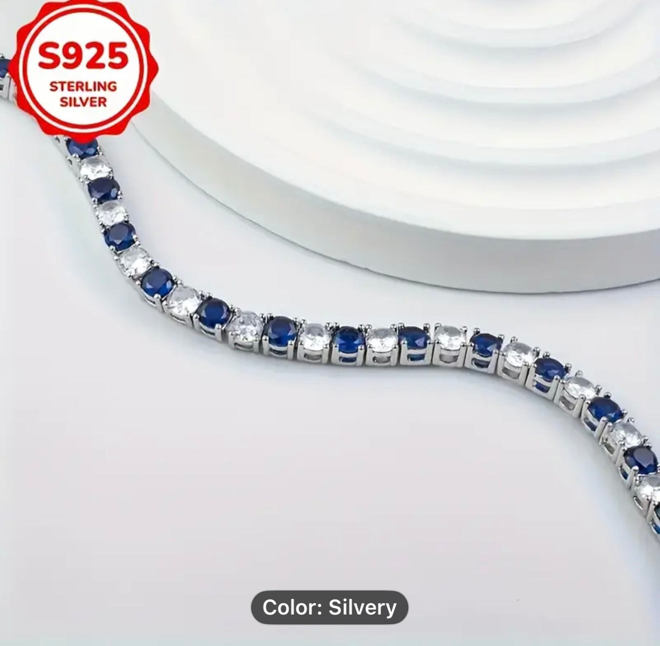 High Quality Crafmanship Silver bracelet with blue and clear stones, featuring 'S925 Sterling Silver' label.