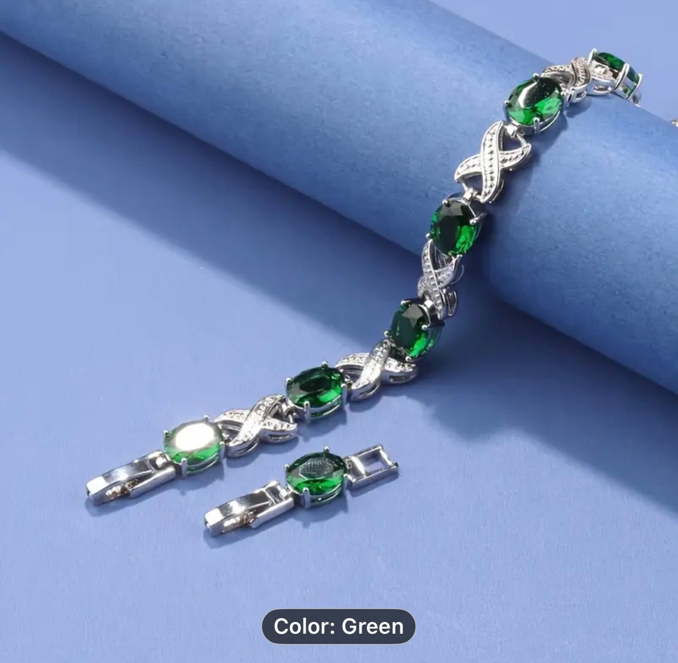 Classic Silver bracelet with green gemstones.
