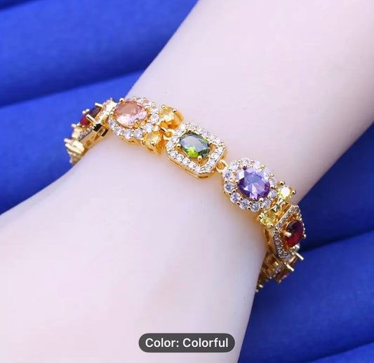 Elegant and Luxurious Gold bracelet with colorful gemstones.