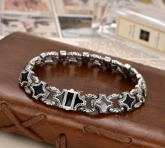 Silver bracelet with black accents