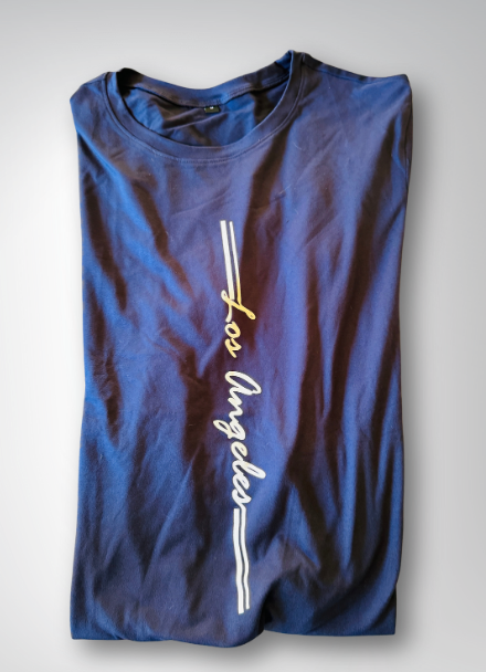 Blue t-shirt with 'Los Angeles' text on a light gray background