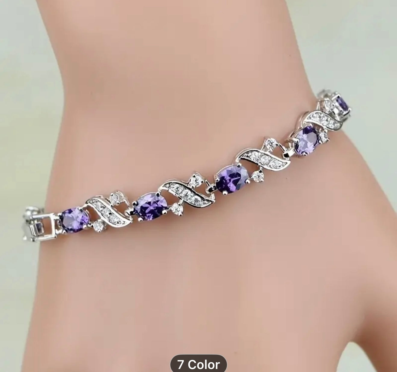Silver bracelet with purple gemstones on a wrist - Elegant and sophisticated