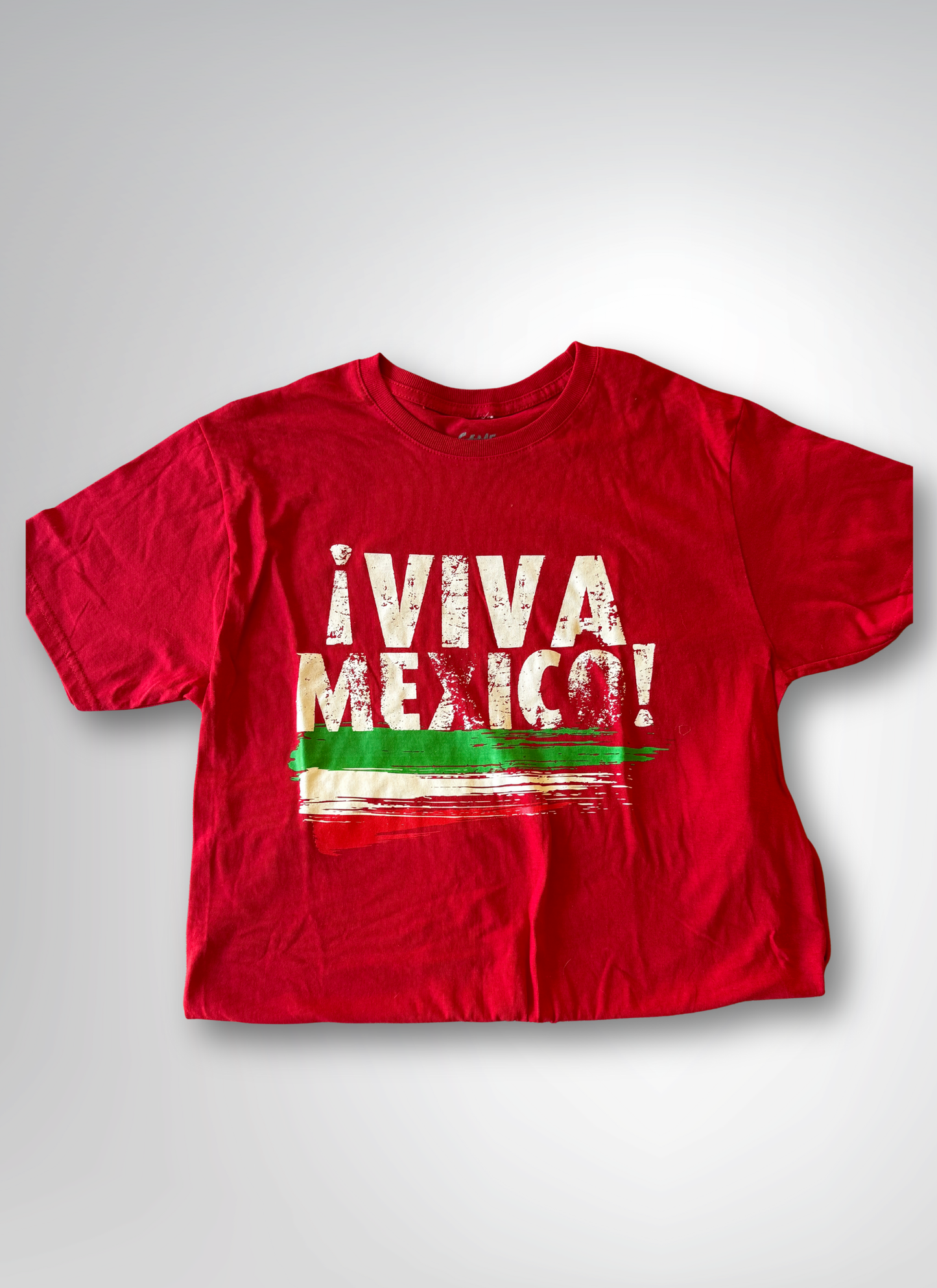 Red t-shirt with 'Viva Mexico!' text on a gray background